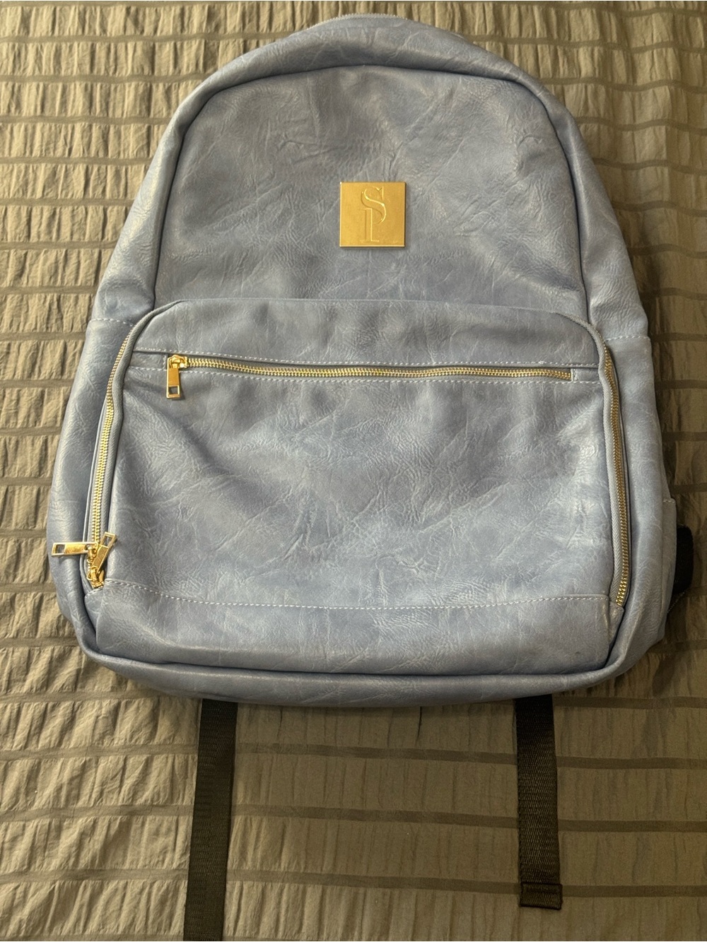 Light Blue Backpack with Gold Logo and Trim